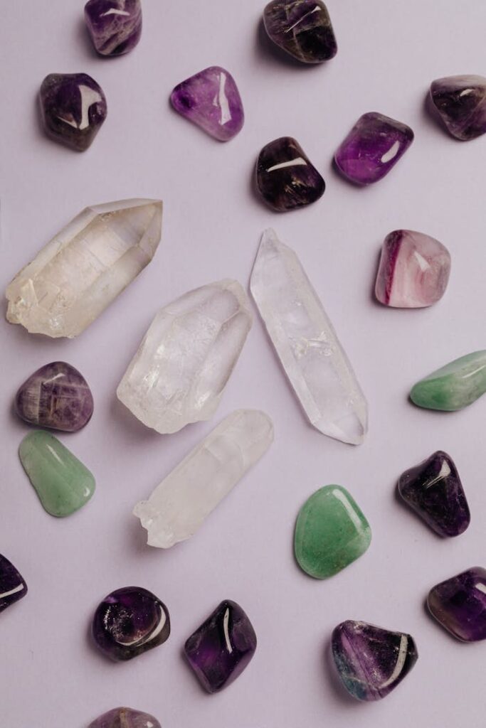 Flat lay arrangement of diverse crystals, showcasing various colors and textures.